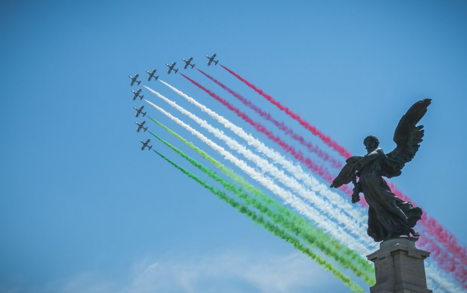 airplanes forming in V formation during daytime