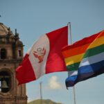 a couple of flags flying next to each other